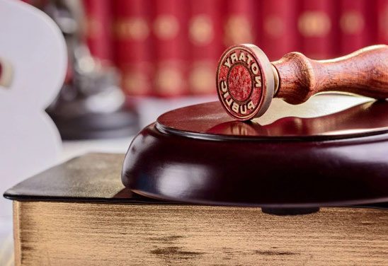 A wooden gavel on top of a table.